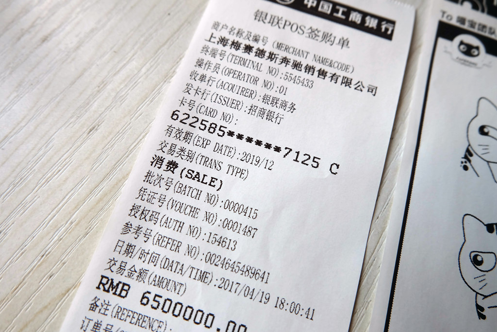 装纸略差一点：10、下图是官方纸打印的两张测试：11、收款小票微距特写：